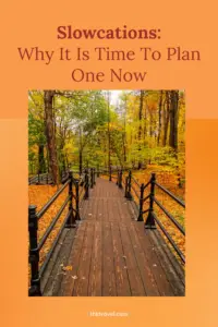 Slowcations post photo of a bridge in a forest during Fall